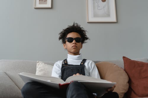 Boy in White Turtleneck Long Sleeve Shirt Wearing Black Sunglasses