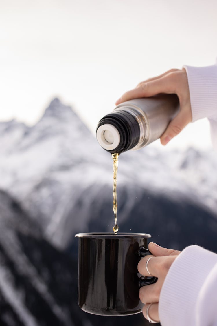 Pouring Drink From Vacuum Flask