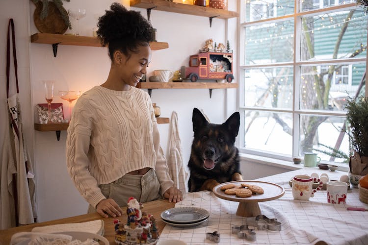 A Happy Woman Looking Her Dog