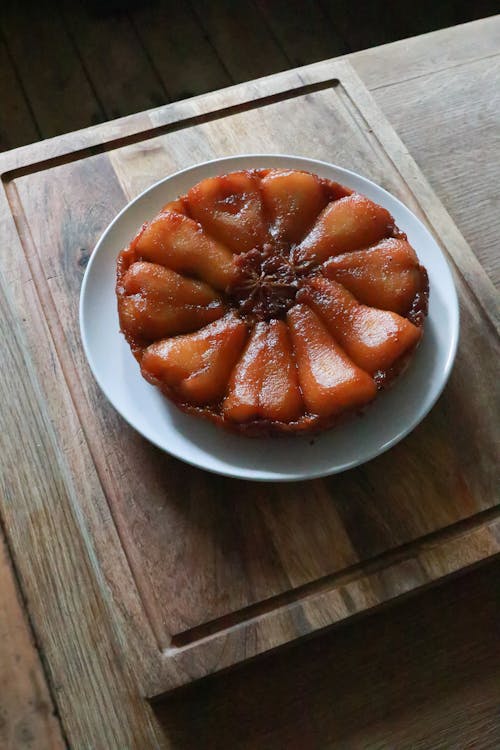 Tart Tatin with pears on plate on table