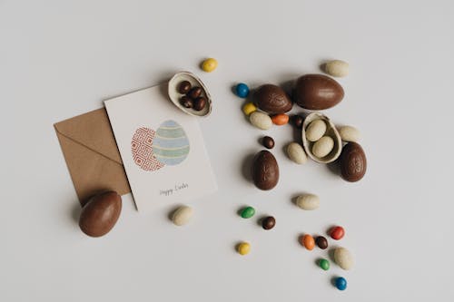 Top View of Chocolate Easter Eggs and Card