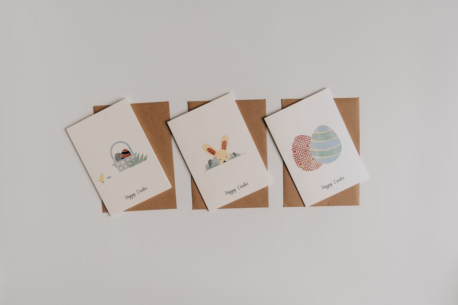Four delightful Easter greeting cards with envelopes on a white background.