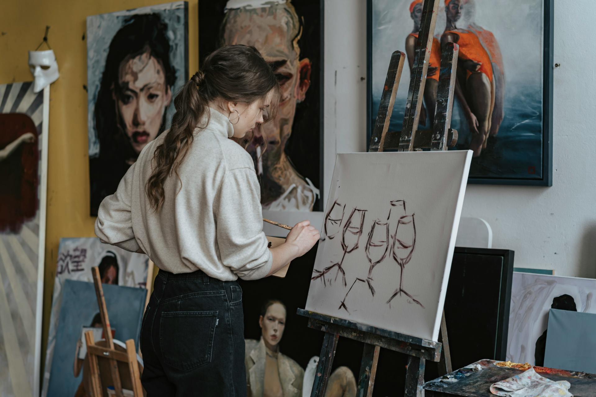 A Woman Painting Wine Glasses on a Canvas