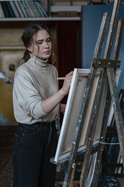 Close-Up Shot of a Woman Painting