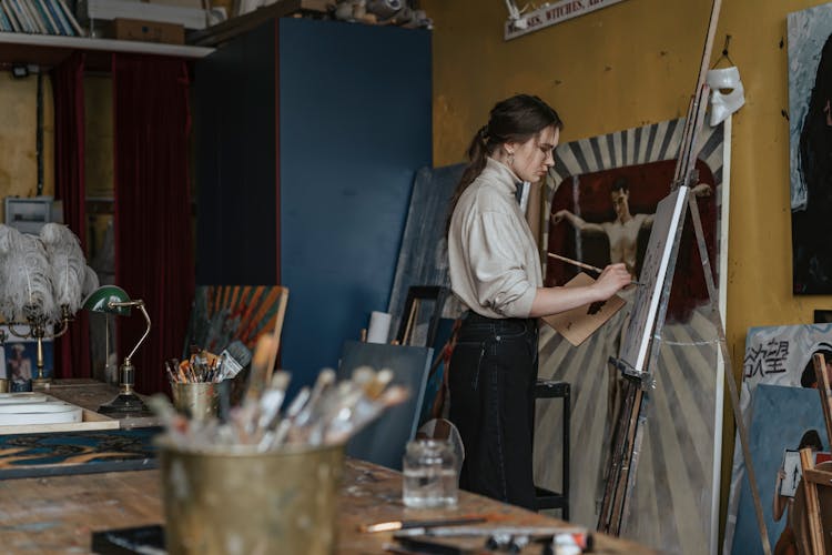 Woman In Turtle Neck Sweater And Black Pants Painting