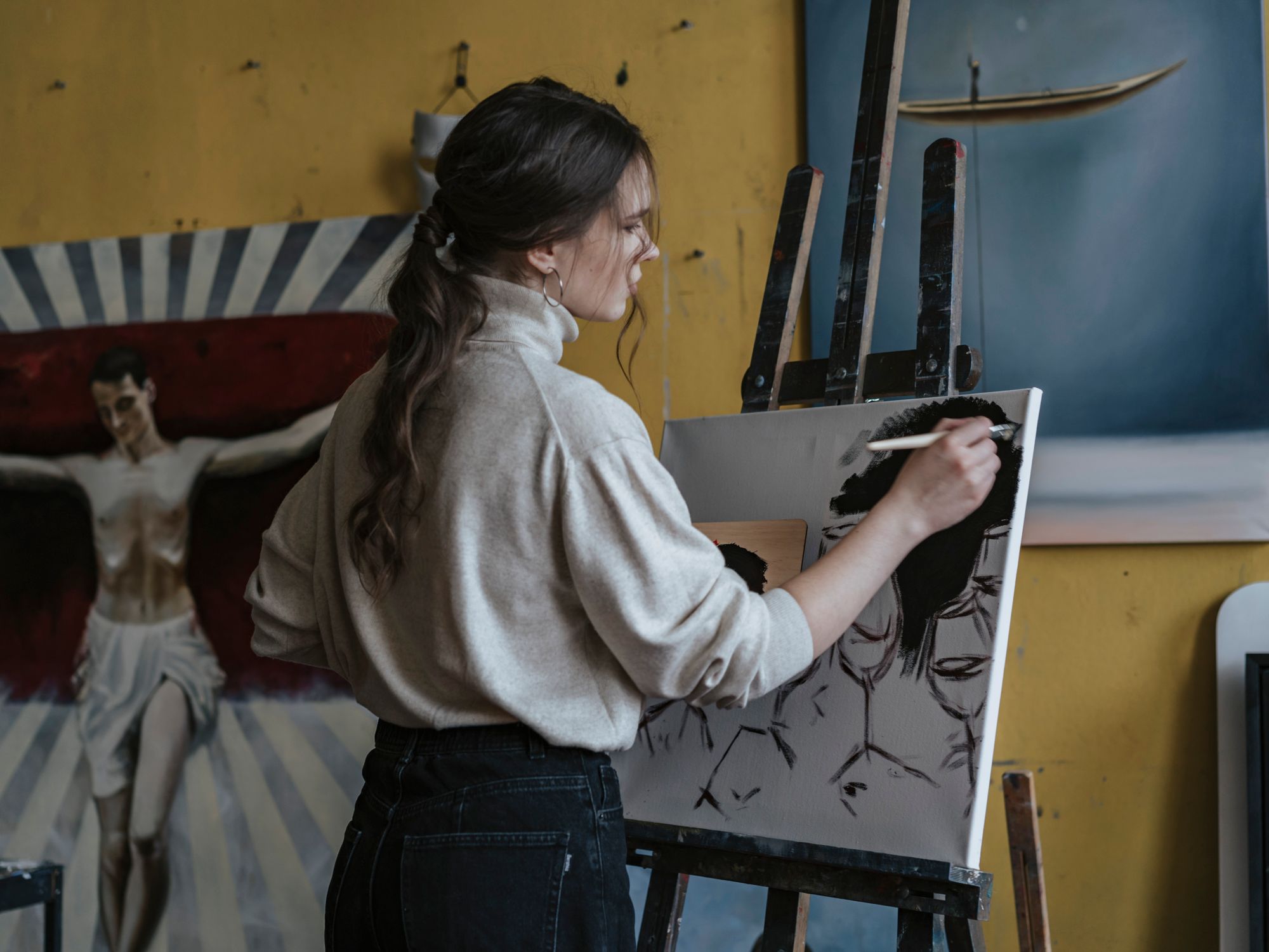 Painters & Decorators in Harlington, London — professional decorator painting a wall with a roller