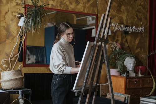 A Woman Painting on a Canvas 