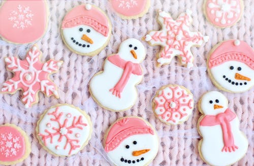 Pink and White Ginger Bread Cookies on a Net Fabric
