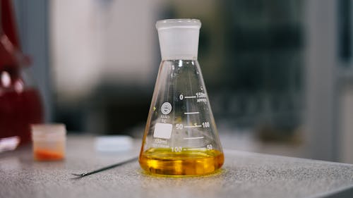 Free Erlenmeyer Flask with Colored Liquid Inside Stock Photo