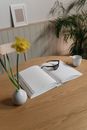 A Braille Book Lying on a Wooden Table