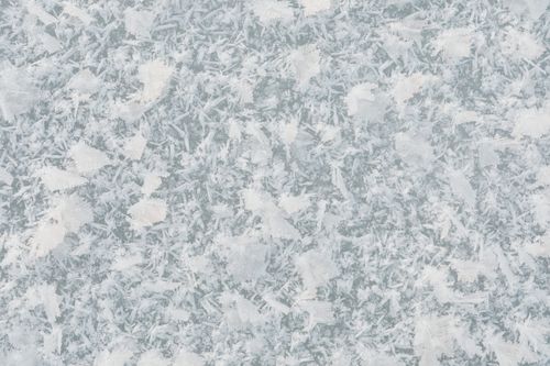 Free Detailed close-up of delicate frost patterns on a glass surface, showcasing winter textures. Stock Photo