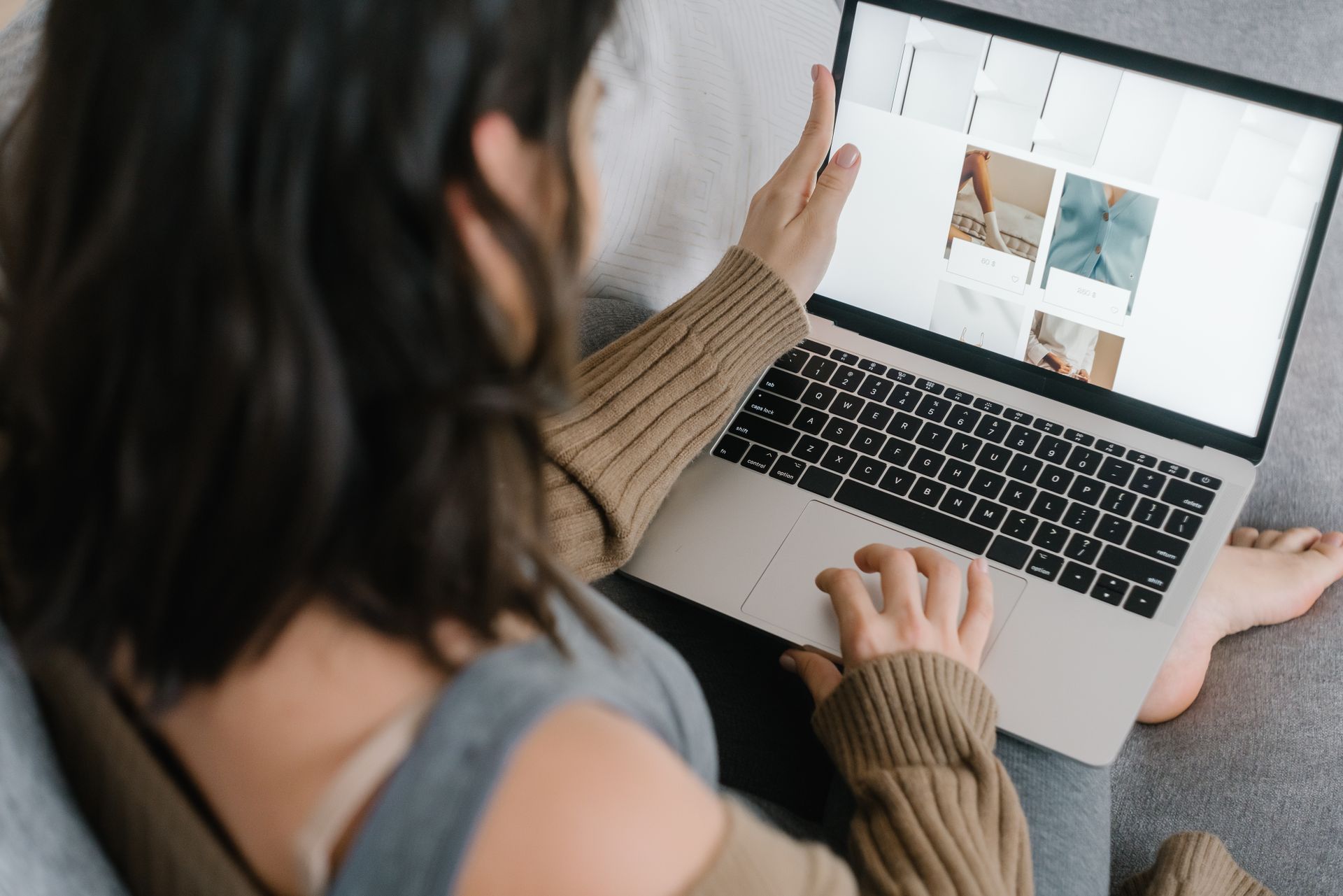 A Woman Busy Browsing Her Laptop