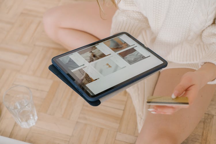 Person Purchasing Online Using An IPad 