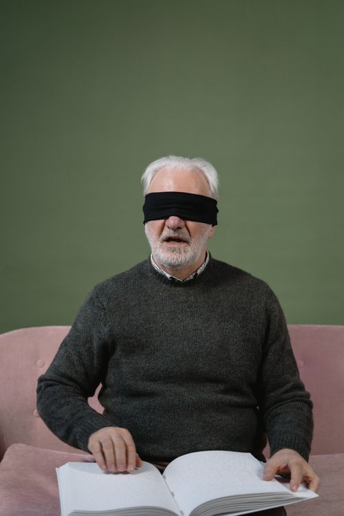 A Blindfolded Man Reading By Braille Method Free Stock Photo a-blindfolded-man-reading-by-braille-method-free-stock-photo
