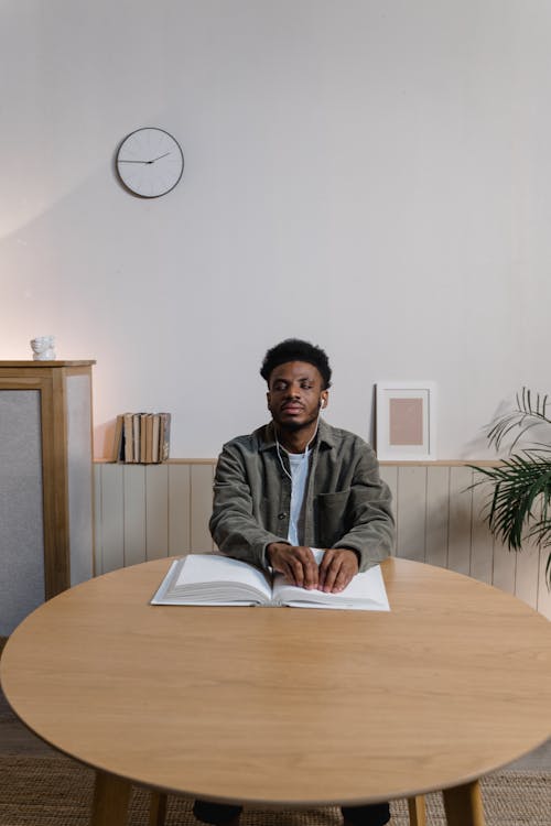 A Man Sitting at the Table · Free Stock Photo