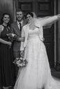 Woman in White Wedding Gown Holding Bouquet of White Flowers