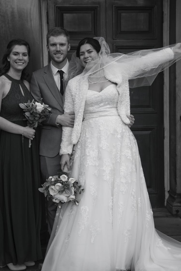 Newlyweds Posing By Door