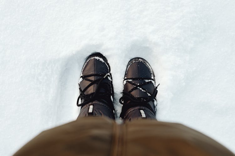 Legs In Boots In Snow