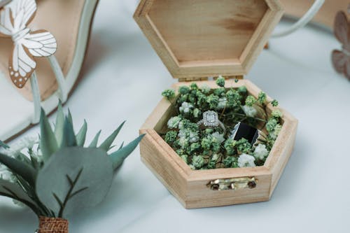 Stylish wedding rings in creative wooden box