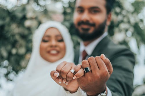 Free Wedding Indian couple showing rings on fingers Stock Photo
