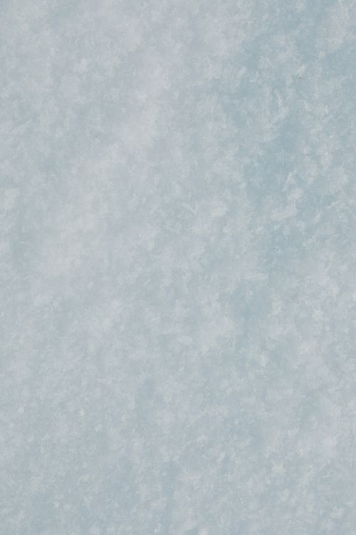 Free Close-up of a textured snow and ice surface, ideal for winter backgrounds. Stock Photo