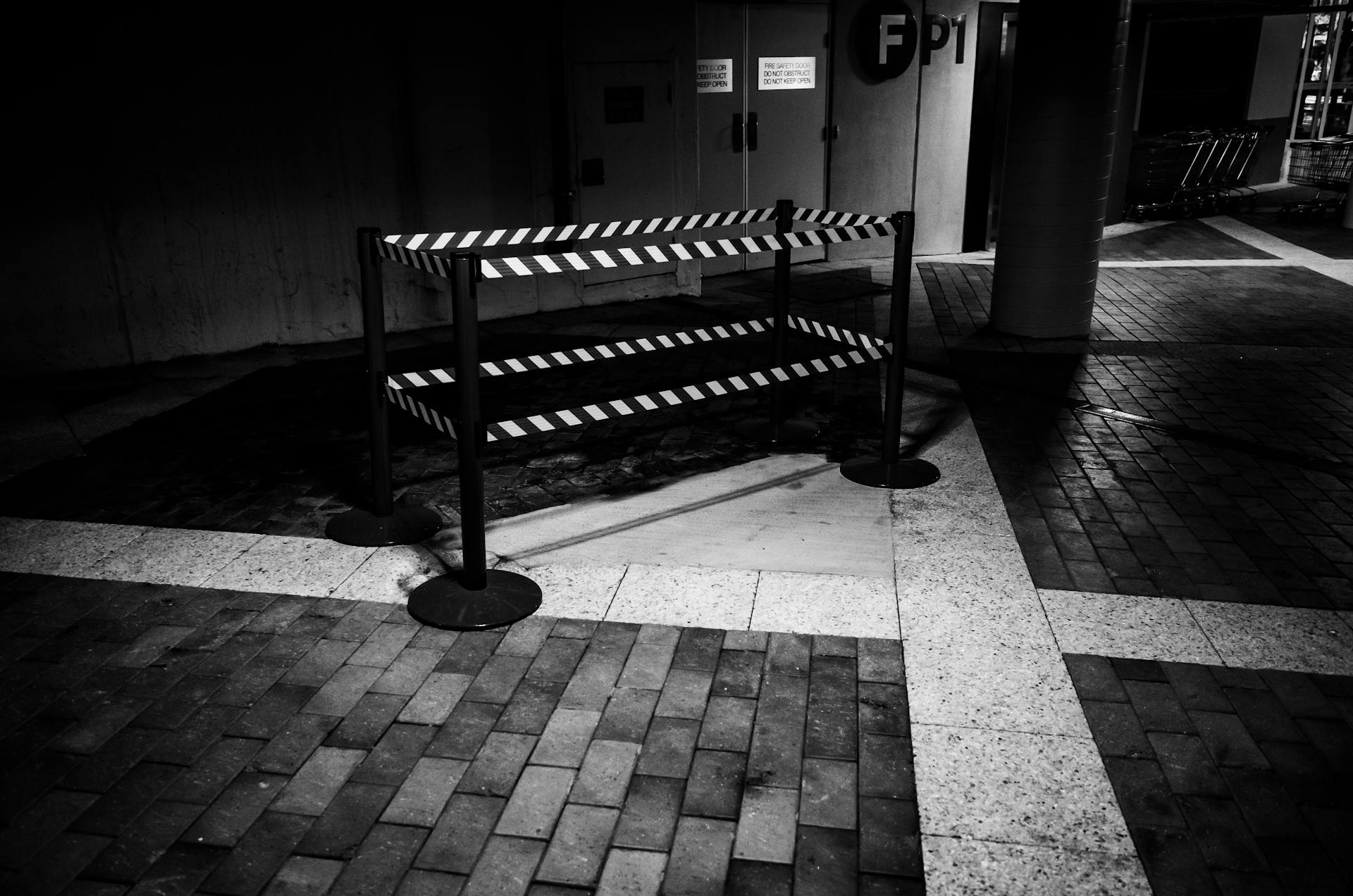 Barrier with Retractable Tape on Sidewalk