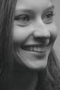 Grayscale Photography of a Beautiful Woman Smiling