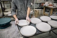 A Person Arranging Plates