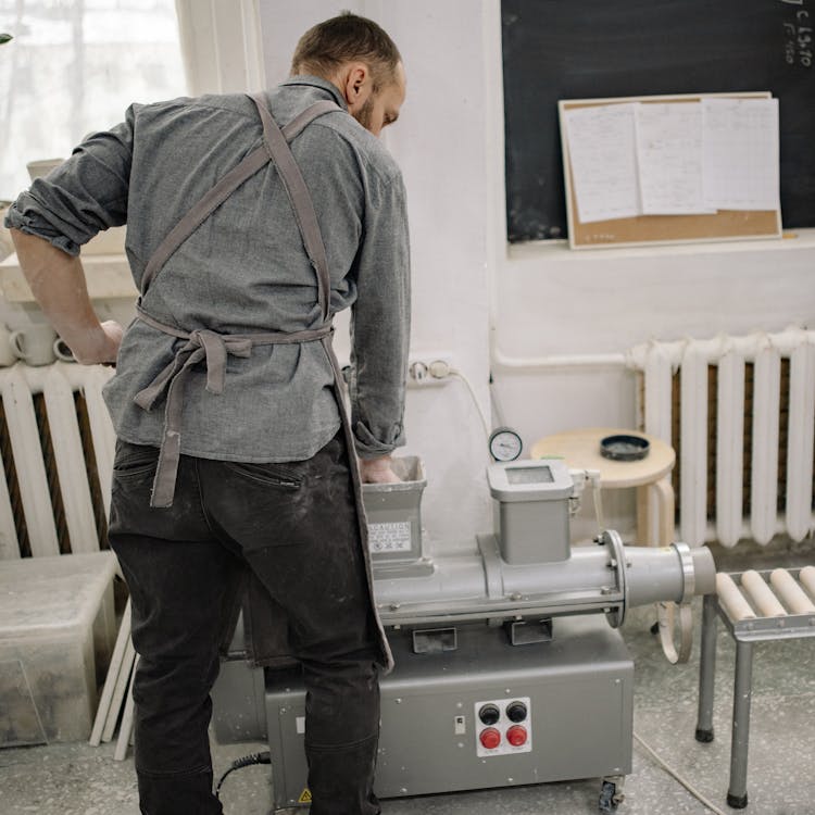 Potter Working With A Machine