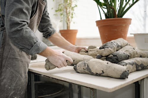 Man Working with Clay in Workshop