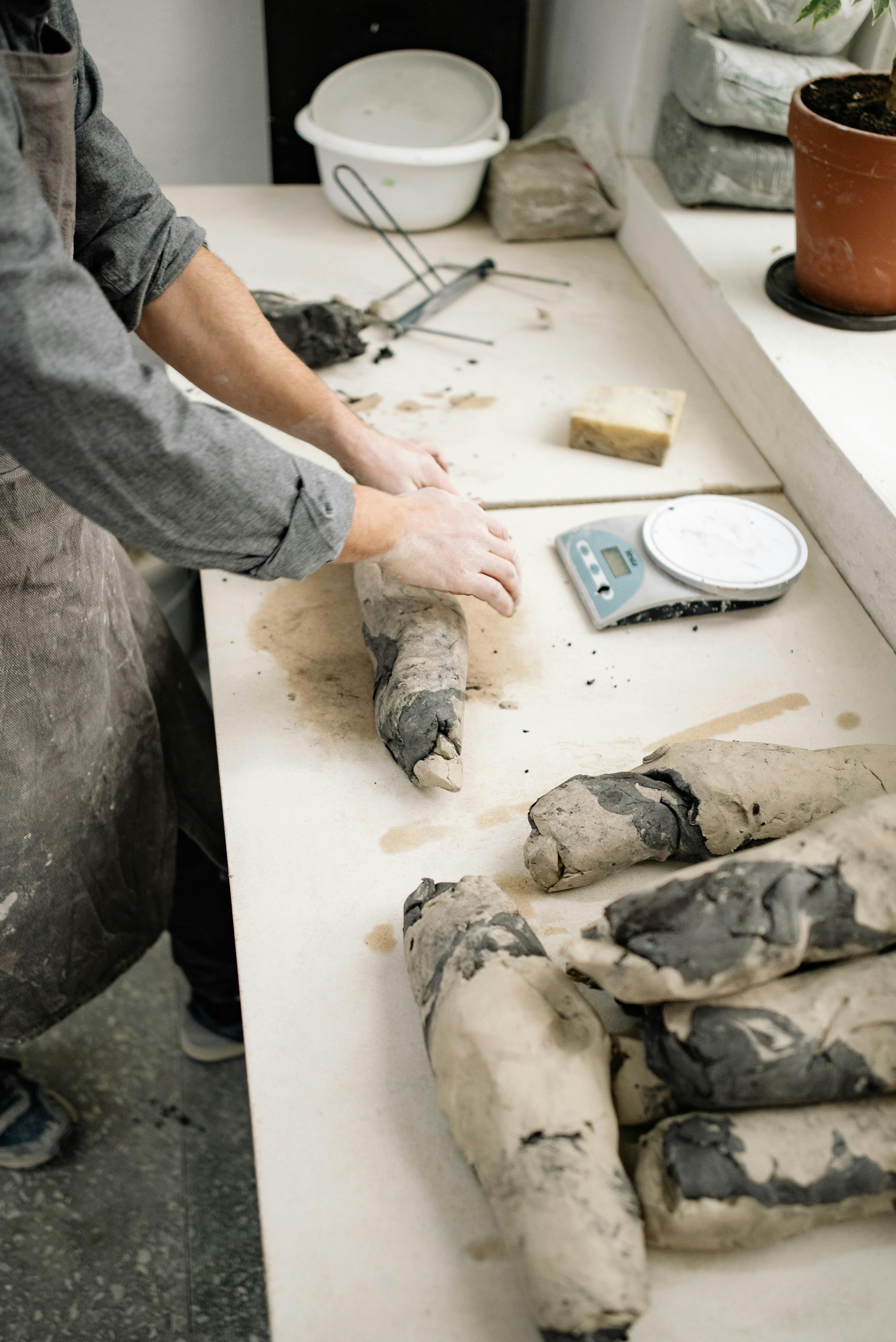 Close-Up Shot of a Person Molding Clay · Free Stock Photo