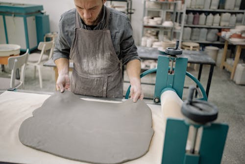 Man Working with Clay in Workshop