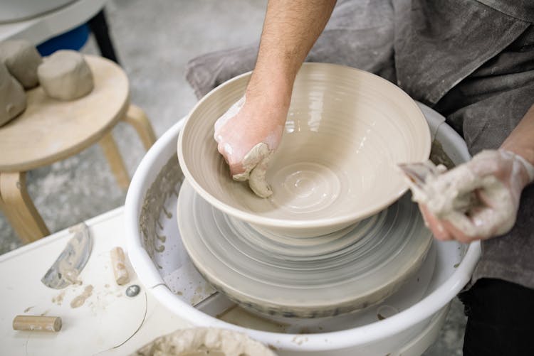 Person Making Clay Bowl