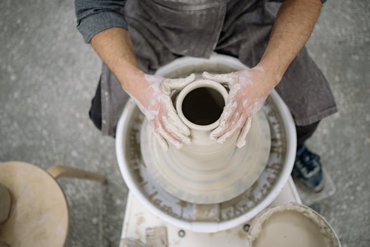 Close-up Of Person Creating Pottery At Workshop