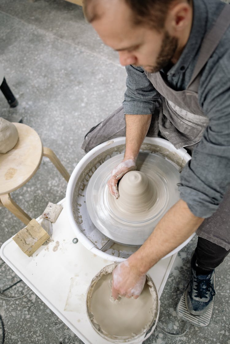 Man Working As Potter