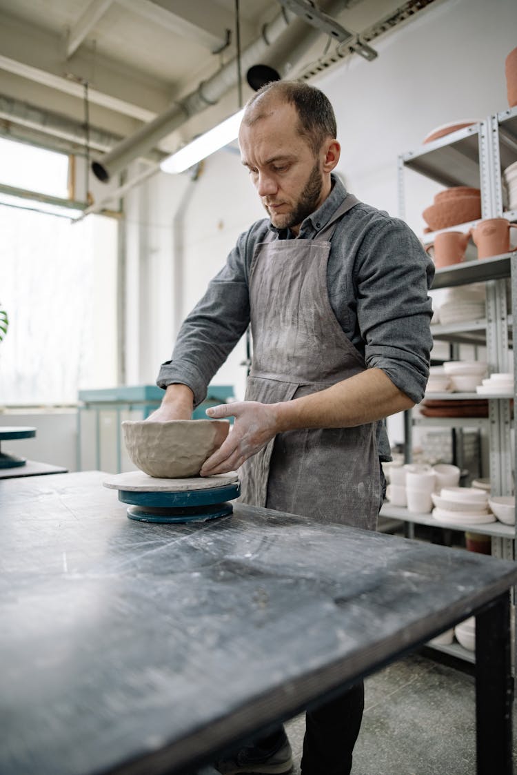 Man Making A Clay Pot 