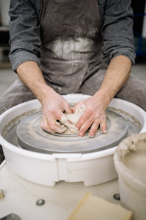 Person Making Clay Pot