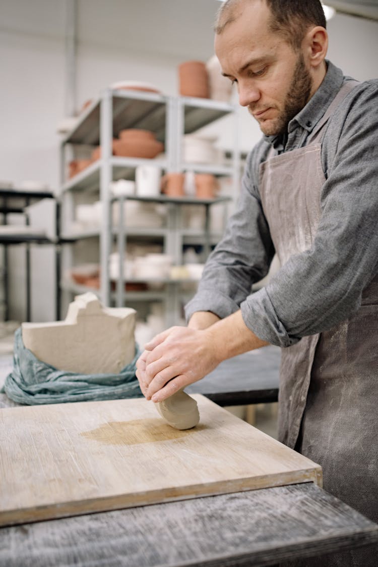 Male Potter Kneading Clay