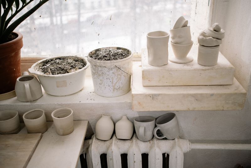 Handmade cups drying on a studio windowsill by Yan Krukau on Pexels