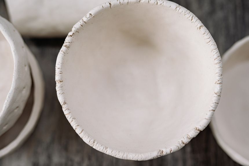 Handmade ceramic bowl with a textured rim, photographed from above. Photo by Yan Krukau on Pexels.