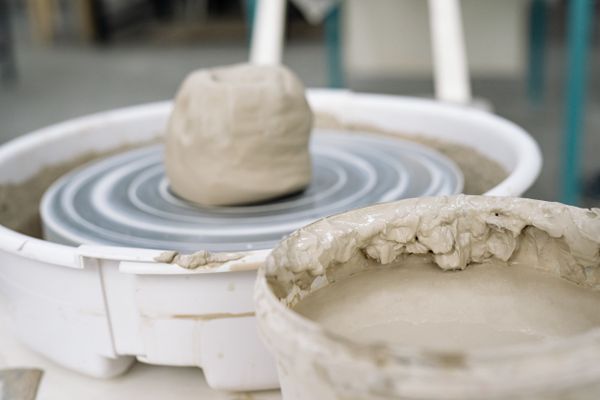 Wet clay being shaped on a pottery wheel — Yan Krukau on Pexels