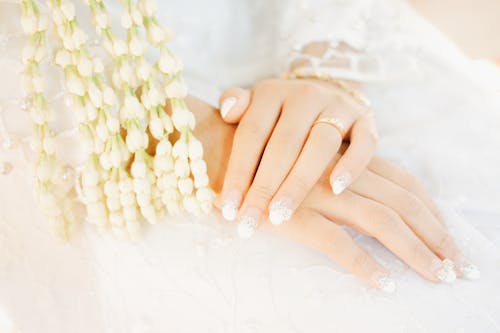 Free Persons Hand on White Textile Stock Photo