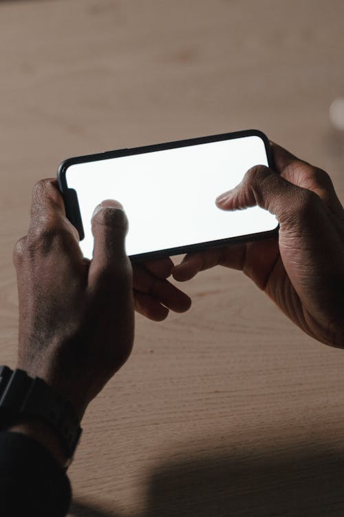 Close-Up Shot of a Person Holding a Smartphone