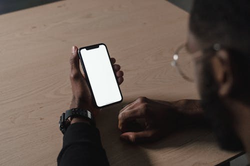 Close-Up Shot of a Person Holding a Smartphone