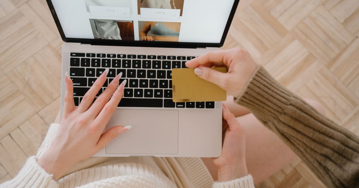 A customer completes an online purchase on a laptop, the faster experience a headless storefront is meant to deliver