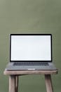 Gray and Black Laptop on Brown Wooden Table