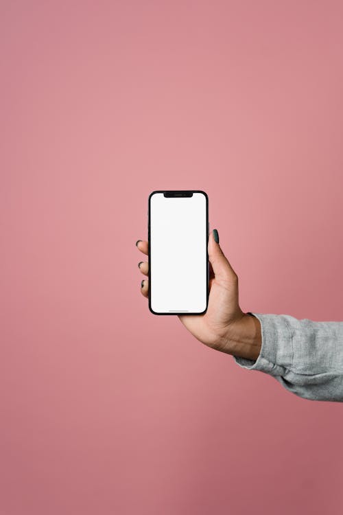 Close-Up Shot of a Person Holding a Cellphone