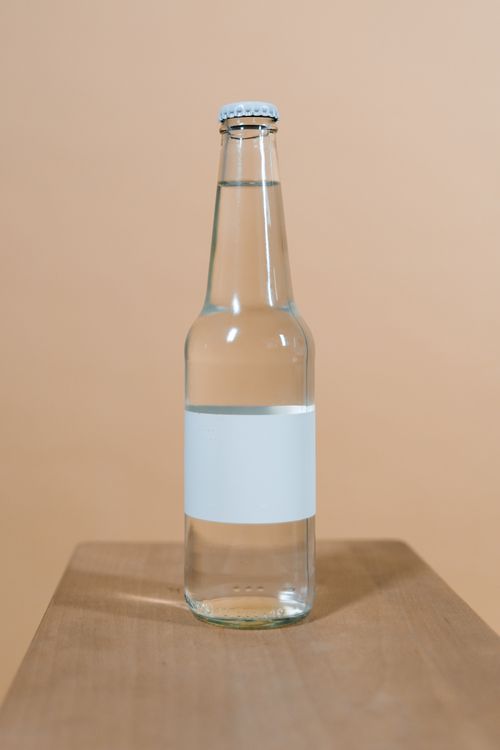 Blank-label glass bottle, retouched product shot — photo by Tima Miroshnichenko on Pexels