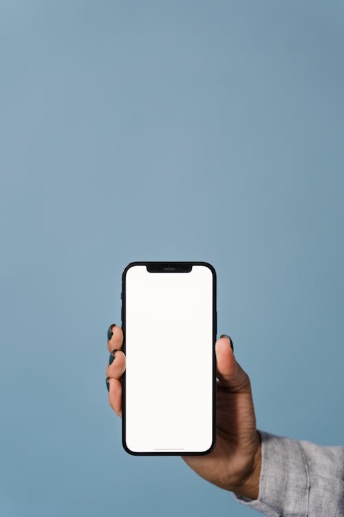 Free Person Holding White Smartphone With Black Case Stock Photo