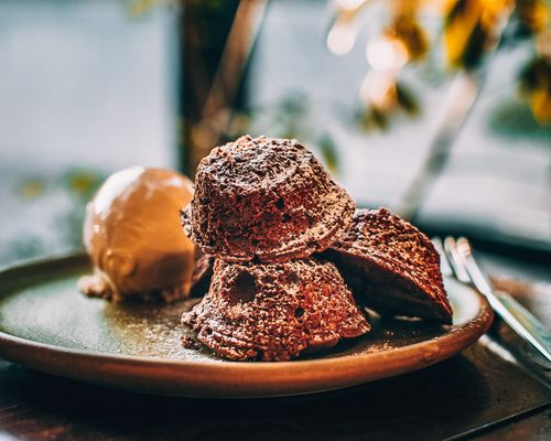 Free Tasty brownies served with a scoop of vanilla ice cream on a rustic plate. Stock Photo
